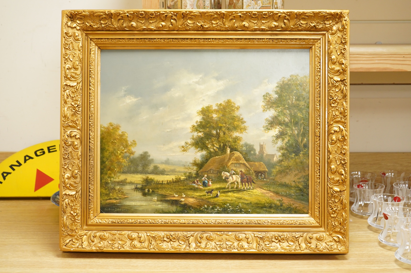 Gudrun Sibbons (1924-2020), Landscape with figures and carthorses before thatched cottages, signed, oil on board, 39 x 49cm, ornate gilt frame
